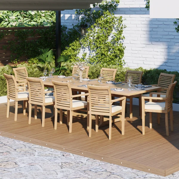Teakhouten tuinset bestaande uit een uitschuifbare rechthoekige tafel van 200-300 cm met een blad van 4 cm dik, 10 stapelbare Oxford-stoelen en gratis kussens.