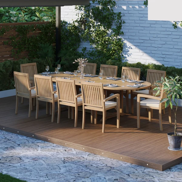 Teakhouten tuinmeubelen: ovale uitschuifbare tafel van 2-3 meter met een blad van 4 cm dik, inclusief 10 stapelbare Henley-stoelen en gratis kussens.